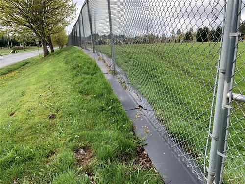 Fence guarding along district properties will prevent weeds from growing and the requirement of herbicide application. 
