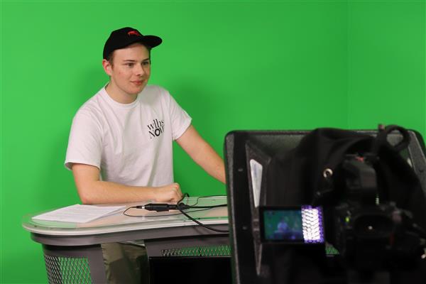 A student gets ready to broadcast